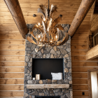 Fallow deer antler chandelier installed in rustic great room