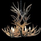 Deerlodge mule deer antler chandelier in natural antler finish with lit candle-style bulbs, studio shot