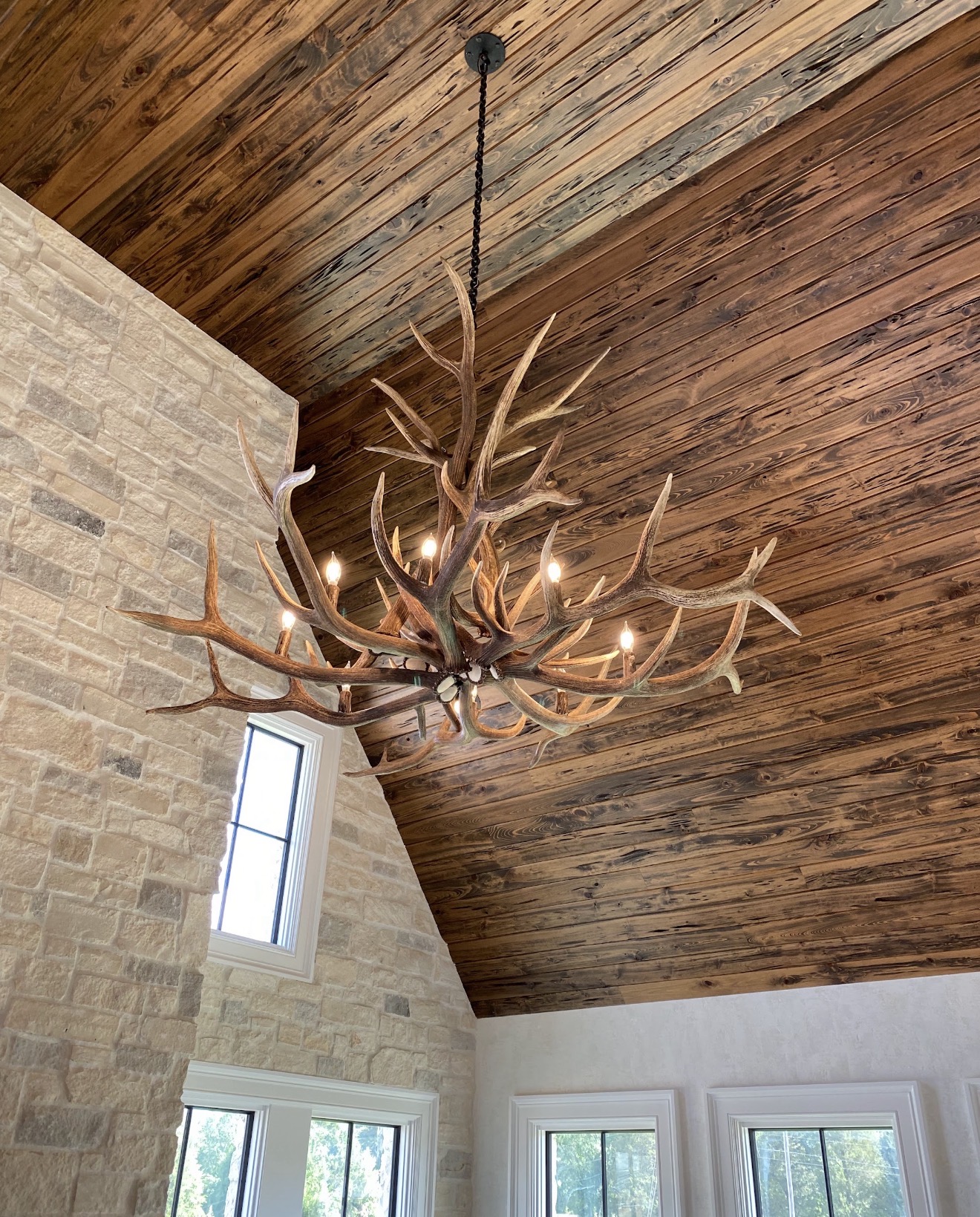 Yellowstone Elk Antler Chandelier viewed from below at an angle, showing the full spread of tiered elk antlers