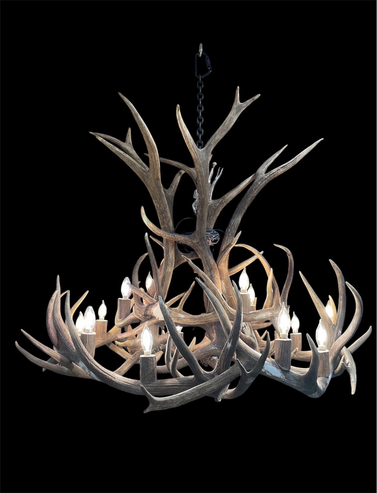 Gallatin Elk and Mule Deer Antler Chandelier lit from the front showing fourteen candle-style lights