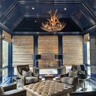 Deerlodge mule deer antler chandelier viewed from across an octagonal navy blue sitting room