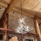Salish Elk & Mule Deer Antler Chandelier lit above a vaulted great room loft