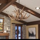 Shoshone Mule Deer Antler Chandelier hanging in a timber-beam great room