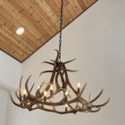 Wilderness Elk Antler Chandelier hanging in a vaulted timber-ceiling great room