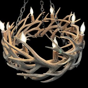 Renegade mule deer whitetail antler chandelier in natural antler finish with eight lit candle bulbs, studio shot