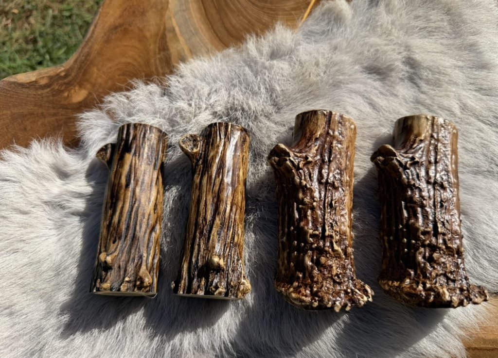 Four resin antler socket covers in two finish styles, showing a consistent, uniform look
