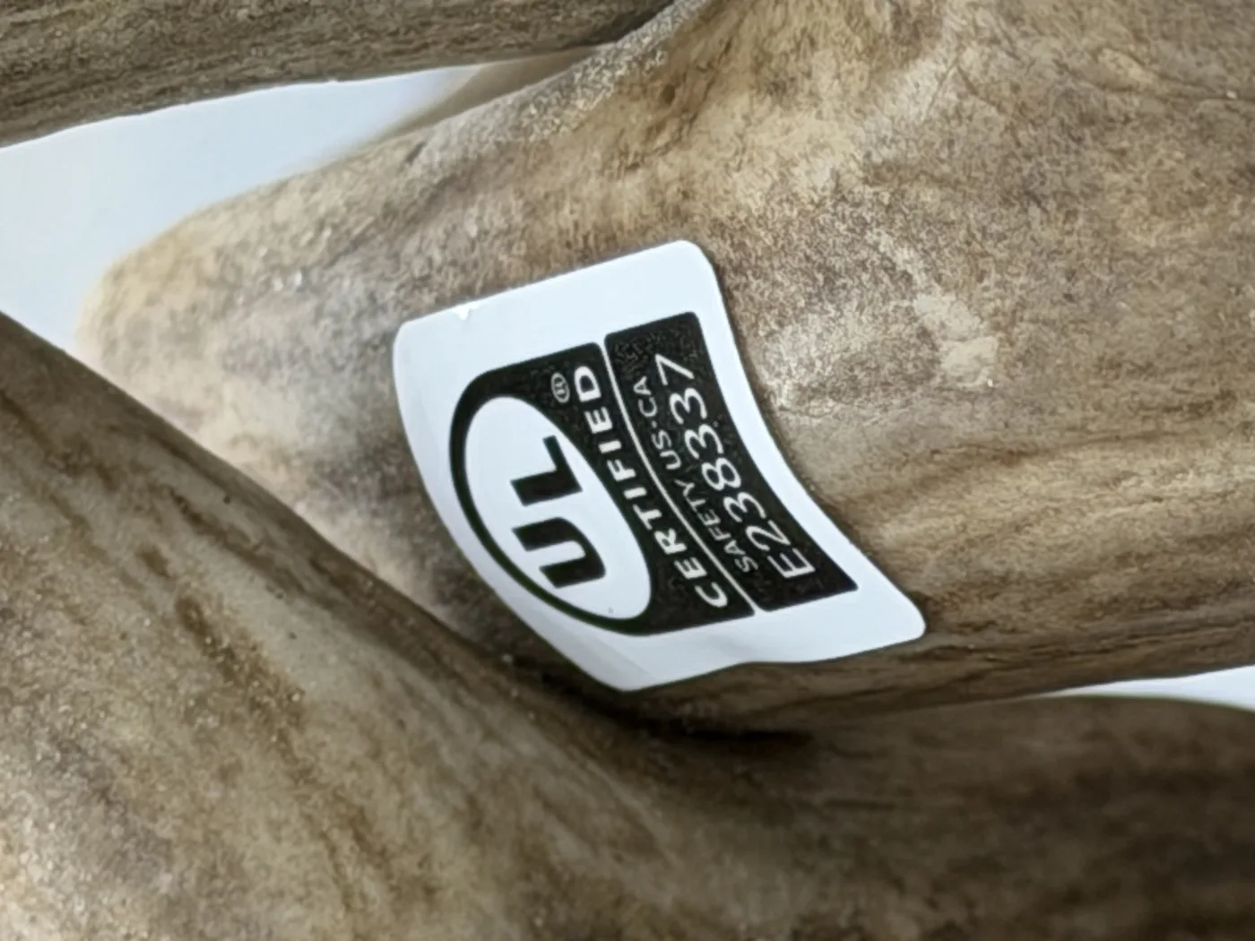 Close-up of the UL Certified safety mark reading US-CA file E238337 applied to a real antler chandelier