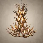 Cascade 3-tier mule deer antler chandelier lit with 12 candle-style bulbs, hanging from a black iron chain