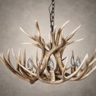 Close-up of a 6 light mule deer antler chandelier showing the open antler build and candelabra lights