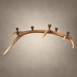 Elk antler candelabra – Extra Large 6 Candle: a long natural elk antler with six rich bronze candle cups set along the beam and tines
