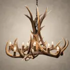 Big Sky elk and mule deer antler chandelier lit with candelabra bulbs, tall antler center and wide ring of antler, front view