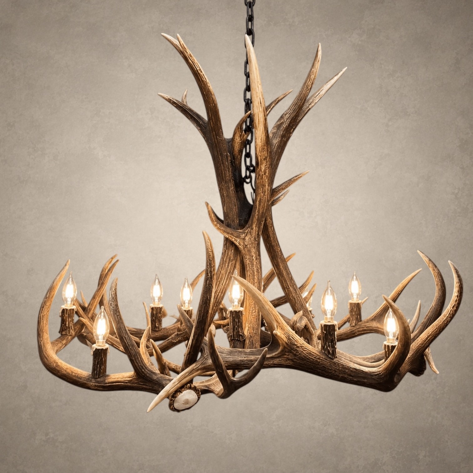 Elk & Mule Deer Antler Chandelier – Big Sky Big Sky elk and mule deer antler chandelier lit with candelabra bulbs, tall antler center and wide ring of antler, front view