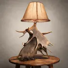 Moose antler table lamp – Kenai: broad moose antler paddles under a laced rawhide shade