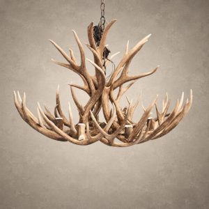 Shoshone mule deer antler chandelier with a wide, low ring of mule deer antler around 8 candle sockets, hanging from an iron chain
