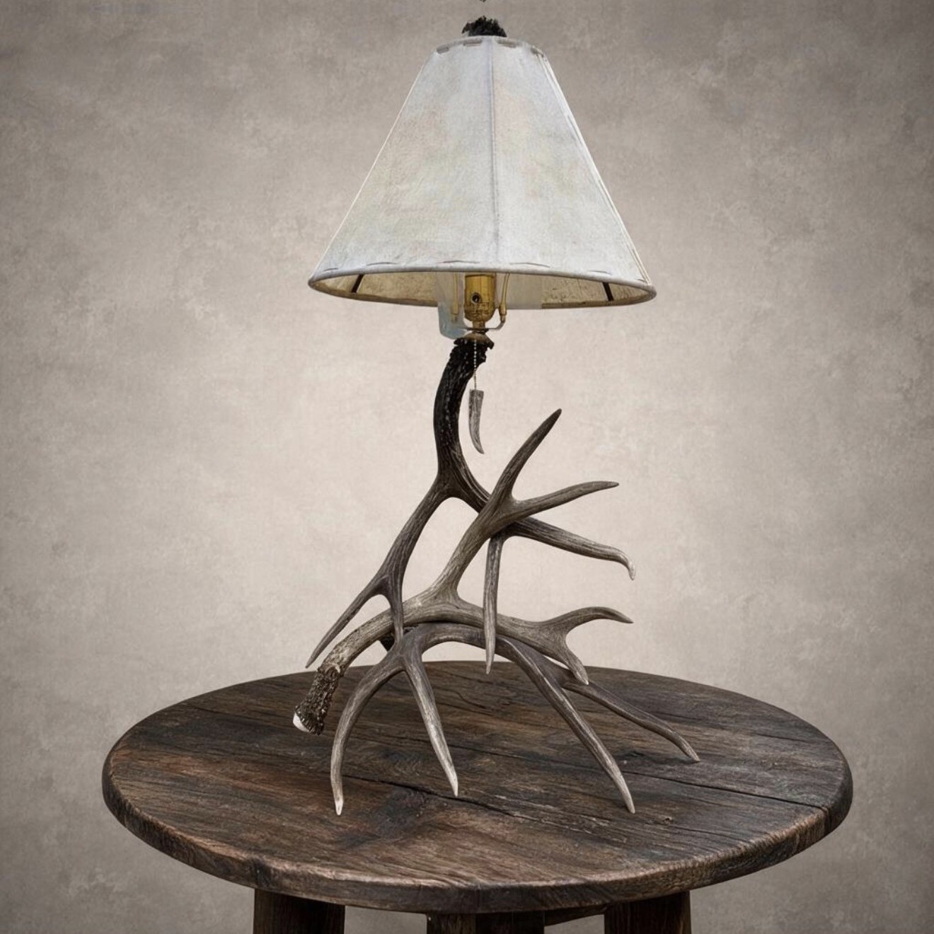 Mule deer antler table lamp – Madison from a second angle, showing the branching mule deer antler base and rawhide shade