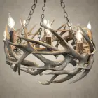 Renegade mule deer and whitetail antler chandelier, a low ring of woven antler with candle-style lights, hung from three iron chains