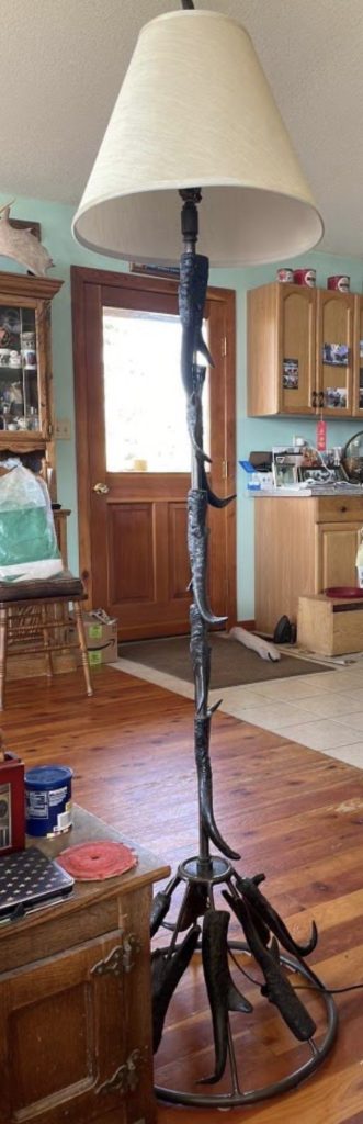 Pronghorn horn floor lamp on welded steel ring base