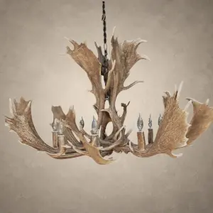 Glacier single tier fallow deer antler chandelier with wide palmated fallow antlers spreading around candle-style bulbs, hanging from an iron chain