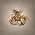 Single Tier Whitetail antler chandelier from an angle, showing the lit candle sockets set among natural whitetail antler