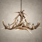 Yellowstone elk antler chandelier from the side, showing the crossed elk antler center rising above the lower antler ring